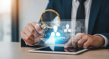 Modern employee screening visualization using digital tablet and magnifying glass highlighting professional profiles and verification process