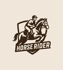 Bold logo of a horse rider on a galloping horse within a shield.