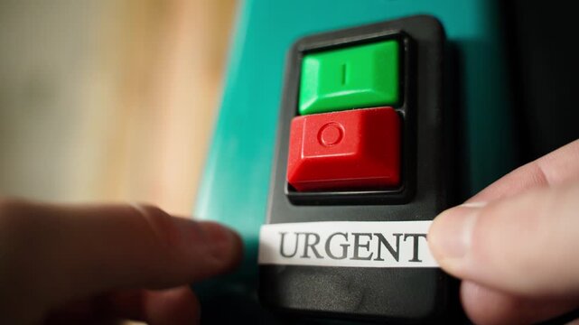 The word URGENT is glued under the large on and off buttons. Red and green button and urgency