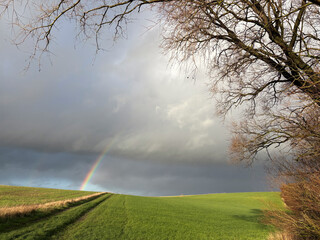 Bright sunny afternoon in late November in the countryside with a rainbow, North Yorkshire, England, United Kingdom