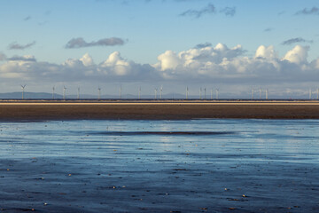 Low tide at     Formby beach with an offshore wind farm visible