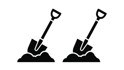 Two black silhouettes of shovels digging into piles of earth silhouette © MdGolam