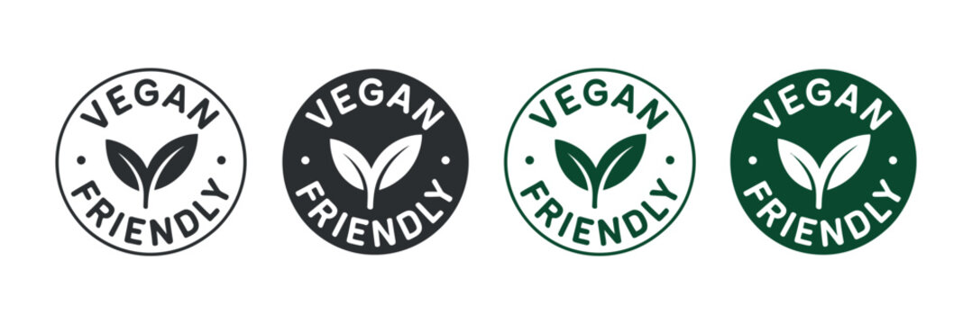 A collection of four distinct vegan friendly certification logos displayed in a row showcasing variations in design and color schemes