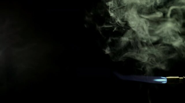 Blue Blowtorch Flame Jet in Smoke