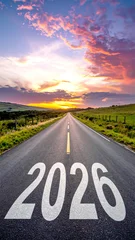 Fotobehang Huisarts „2026“ auf einer Straße mit Pfeil Richtung Horizont bei Sonnenuntergang als Ziel- und Neuanfangskonzept  © Sina Ettmer