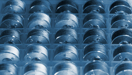 Vintage style plastic sewing machine bobbins.