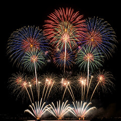 Obraz premium Symmetrical festive fireworks with bright light trails