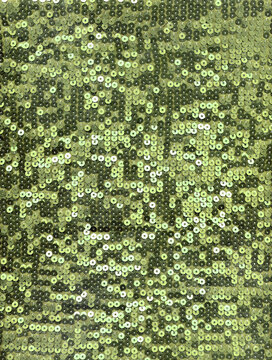 Lime green sequin fabric texture with bright shimmering discs, sparkling background ideal for festive decor, party design, fashion, glam visuals.