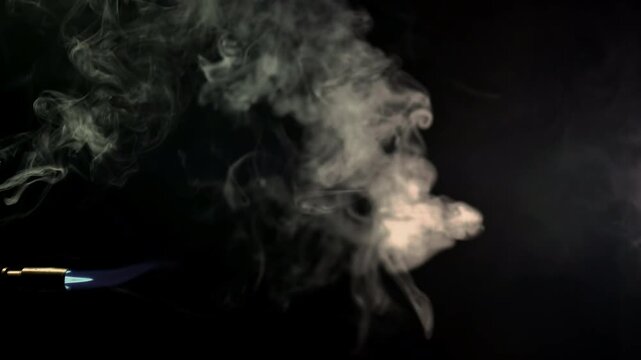 Blue Blowtorch Flame Jet in Smoke 