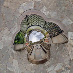 sphere inside overlooking multi-storey buildings of skyscrapers of residential complex, urban development. Transformation of spherical 360 panorama in abstract aerial view.