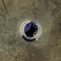 sphere inside overlooking multi-storey buildings of skyscrapers of residential complex, urban development. Transformation of spherical 360 panorama in abstract aerial view.