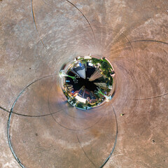 sphere inside overlooking multi-storey buildings of skyscrapers of residential complex, urban development. Transformation of spherical 360 panorama in abstract aerial view.