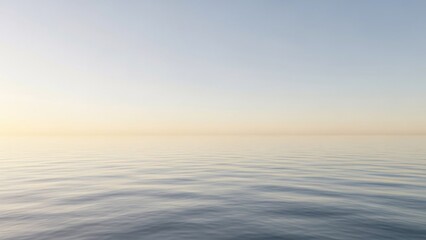 Calm Ocean Water at Sunrise with Clear Blue Sky and Golden Horizon