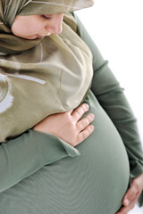Pregnant muslim woman with happy expression