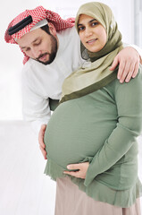 Portrait of a happy young pregnant muslim woman