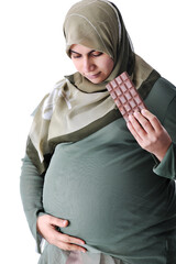 Pregnant muslim woman with chocolate