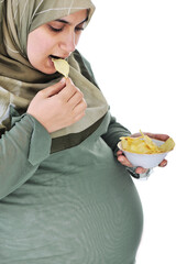 pregnant pretty muslim woman eats chips
