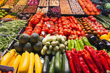Colorful fresh vegetables on display at a local market stall © Aleksandr Fedosov