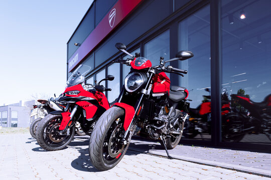 Poznan, Poland - April 28, 2025. Brand new Ducati motorcycles in front of a dealership.