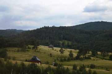 small wooden houses on the mountainside