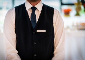 Young waiter at the restaurant