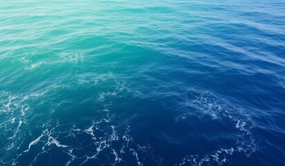Calm azure waves gently ripple under a warm sun in vast ocean space