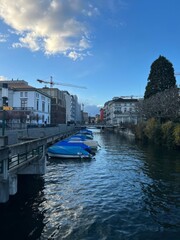 Canal with Boats & European Cityscape