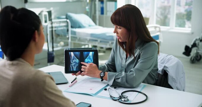 Doctor, woman and tablet xray in consultation for bone fracture, explain results and diagnosis. Healthcare, patient and professional with MRI screen in clinic for knee dislocation and treatment plan