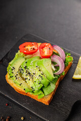 Avocado toast vegetable dish natural product tasty snack fresh delicious gourmet food background on the table rustic top view copy space keto and paleo diet vegan and vegan food