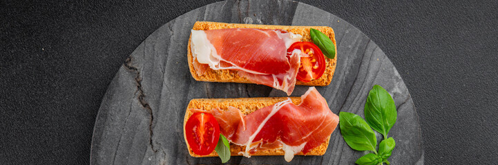 jamon bruschetta prosciutto appetizer portioned tapas dish natural tasty snack fresh delicious gourmet food background on the table rustic top view copy space