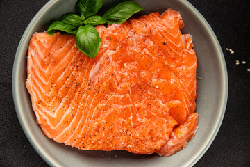 Salmon fillet raw red fish seafood dish natural tasty snack fresh delicious gourmet food background on the table rustic top view copy space pescetarian diet