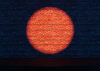 Empty stand-up stage with a spotlights. A bright round light is cast on a dark brick wall.