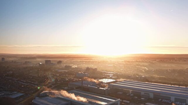 Atmospheric Sunrise Cityscape With Fog and Chimney Steam. Basingstoke. UK