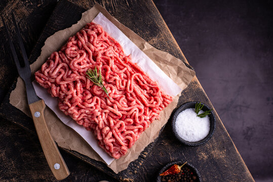 Raw minced meat on dark background