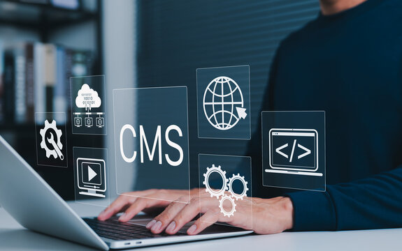 Content management system (CMS) concept. User operating website development tools on laptop, managing web content, cloud data, coding, and multimedia for digital publishing and online presence.