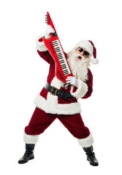 elderly caucasian santa in modern sunglasses and deep red velvet suit shreds a cherry-red keytar in a rock star pose, high-key studio setting with rim lighting. rebellious christmas campaign concept