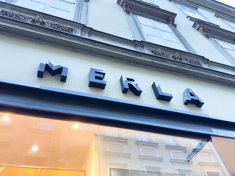 Zagreb, Croatia - December 14, 2025: MERLA storefront sign displayed prominently on a historic building, showcasing modern typography against classic architecture in an urban setting