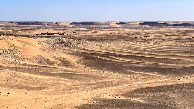 A view from the center of the Richat structure in Mauritania. The desert can be seen and, in the distance, Madame Monod's oasis.