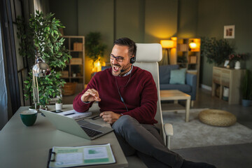 Man using headset while working from home