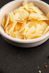 Parmesan cheese slices natural healthy food ingredient appetizer fresh tasty table setting gourmet food background on the table rustic food top view copy space