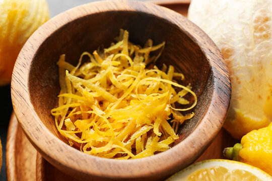 Fresh lemons with zest on table, closeup