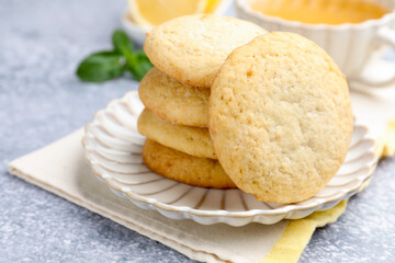Fototapeta premium Tasty lemon cookies on grey table, closeup