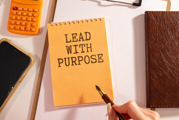 Business concept - Top view notebook writing Lead By Example