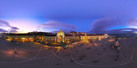 Illuminated Christmas tree at Praca do Comercio in Lisbon during winter twilight