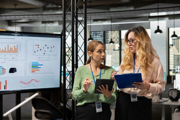 Group of corporate women working on data analysis and setting project goals, empowered and ambitious coworkers doing business planning. Goals oriented collaboration drives modern success.