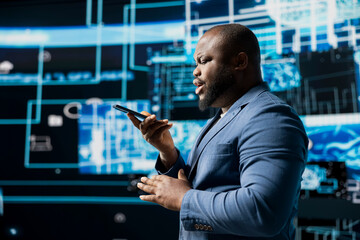 African american expert engaged in a phone call chat about machine learning, surrounded by a virtual interface showcasing AI brain data visualization and high tech innovation.