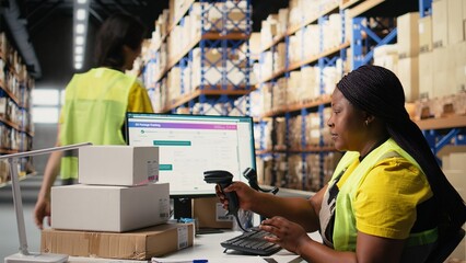 Staff member managing barcodes awb scanning tasks for online shopping orders, merchandise with...