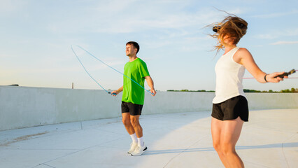 Jump rope activity on a rooftop in the city © muse studio