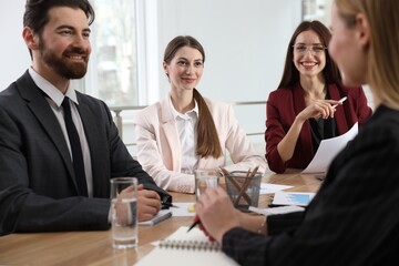 Businesspeople working together at table in office