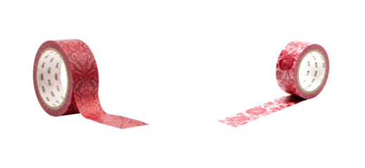 Two red decorative washi tape rolls with intricate floral and damask patterns are unrolling, showcasing their detailed ornamental designs for scrapbooking and crafting